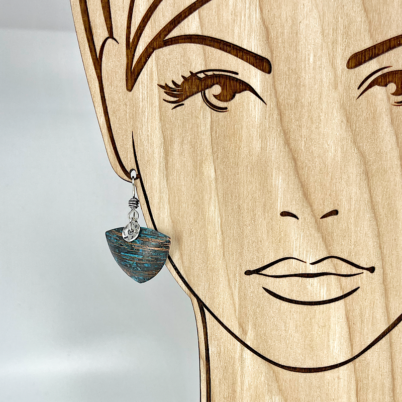 Triangle copper blue patina earring shown on model by Kristin Christopher