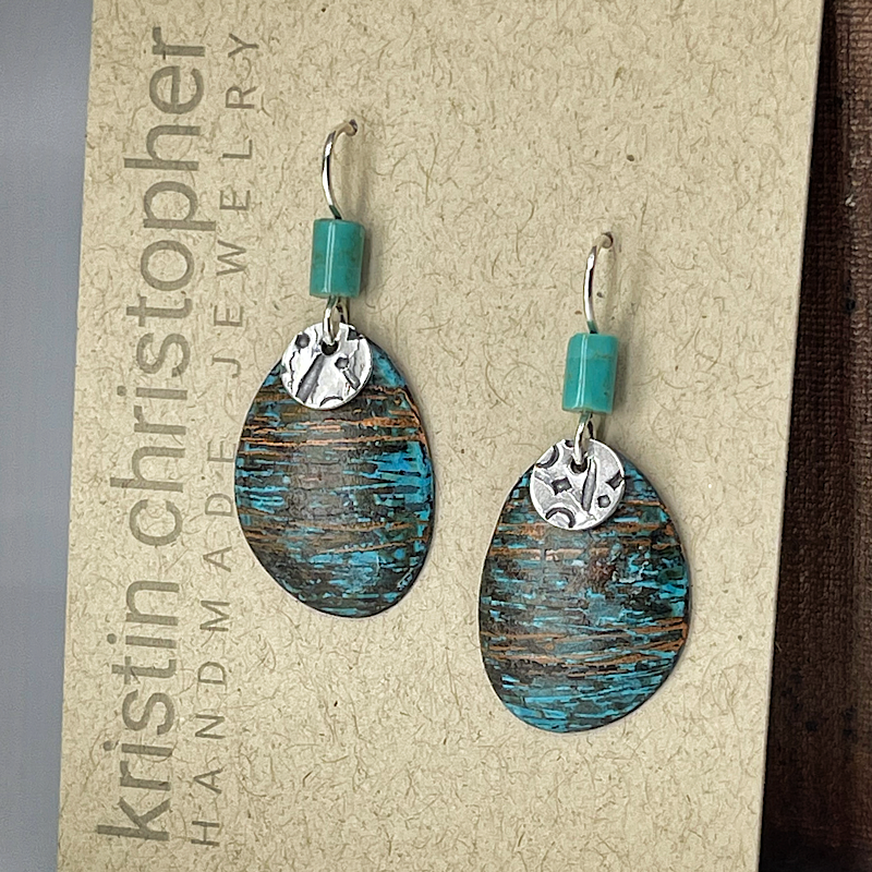 Pair of blue copper earrings on a 'Kristin Christopher' card
