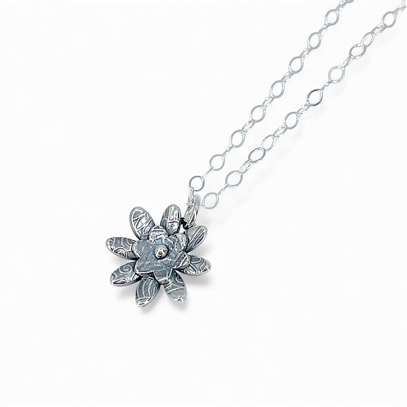 Sterling silver flower pendant with oval link chain