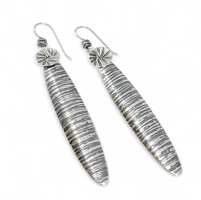 Textural long oval silver earrings by Kristin Christopher