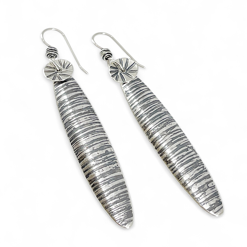 Textural long oval silver earrings by Kristin Christopher