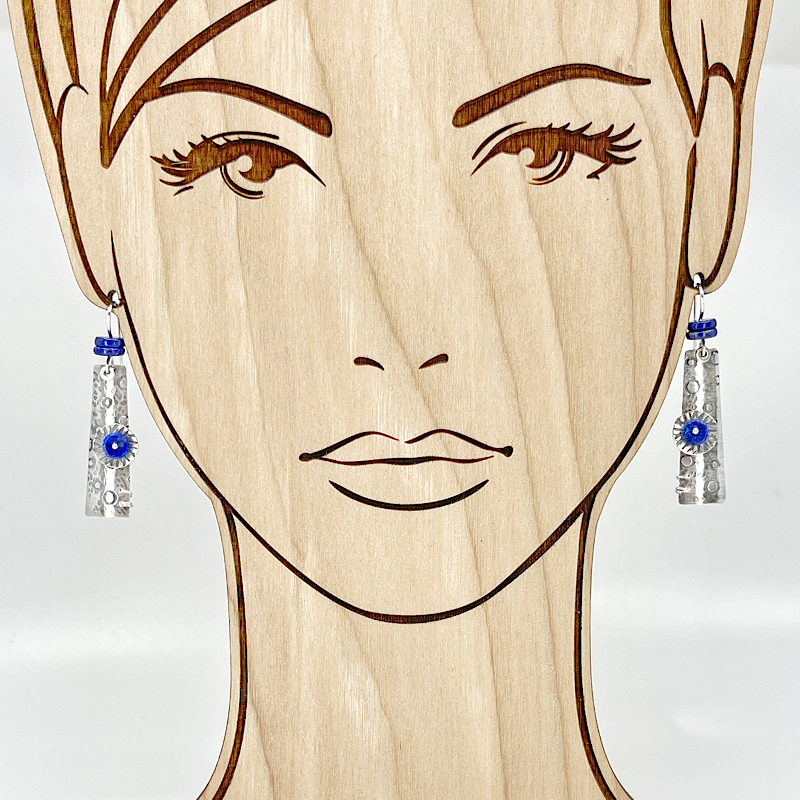 Sterling and lapis earrings shown on model to indicate size