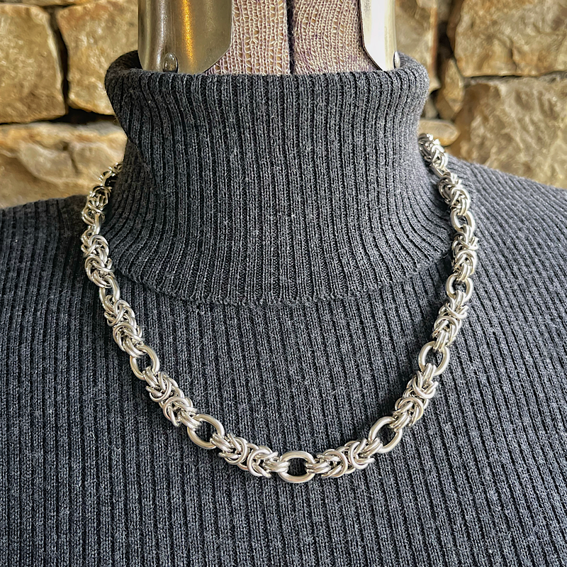 Silver byzantine chainmail necklace on a mannequin.