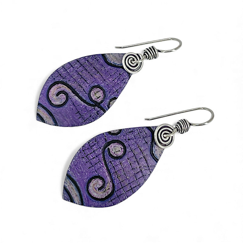 Purple leaf-shaped earrings with sterling silver spirals on a white background