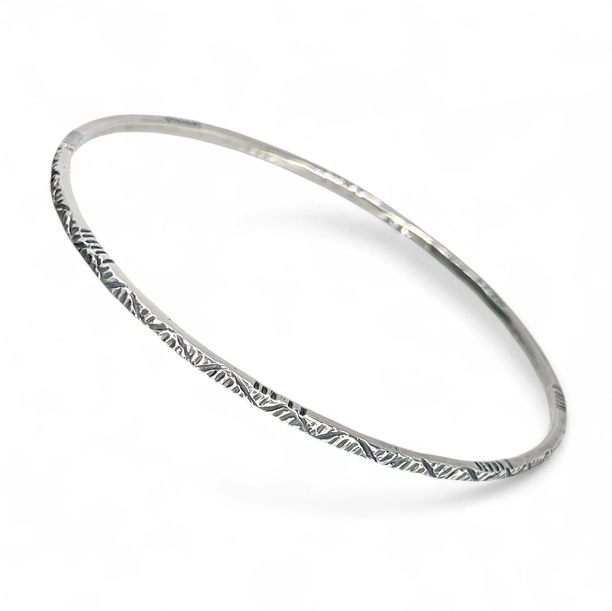 Front view of Kristin Christopher Sterling Bangle Bracelet with zig zag