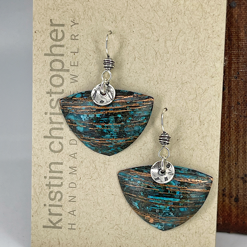 Triangle copper blue patina earrings with sterling silver accents shown on card