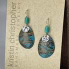 Pair of blue copper earrings on a 'Kristin Christopher' card