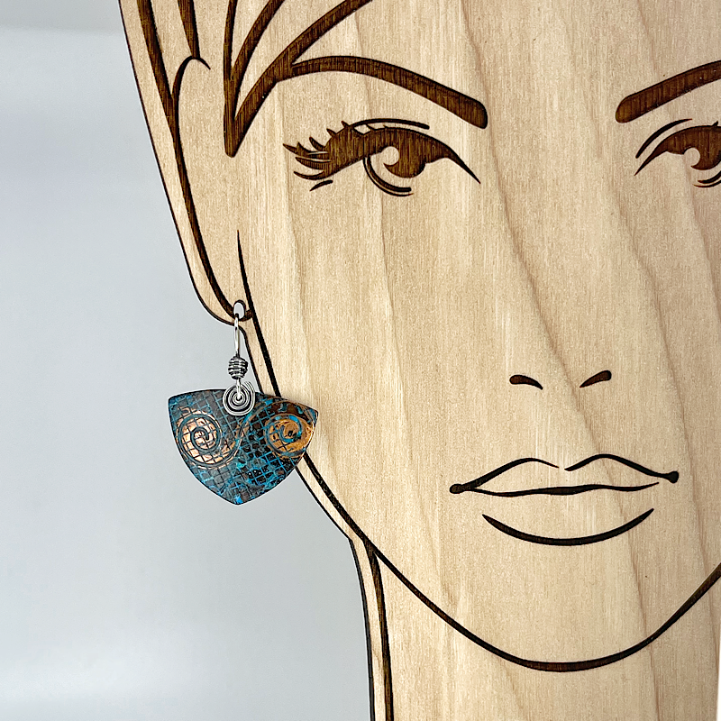 Triangle blue patina copper earring shown on model