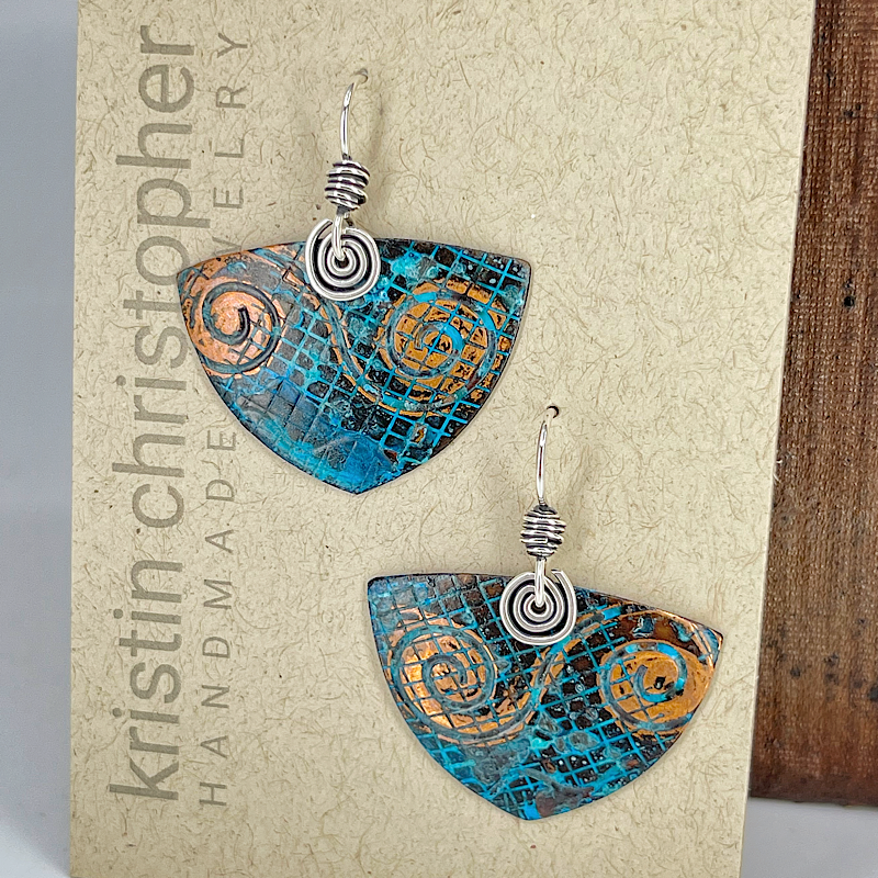 Pair of blue patina copper triangle earrings on 'Kristin Christopher' card
