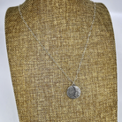 Sterling silver crescent moon pendant shown on linen bust