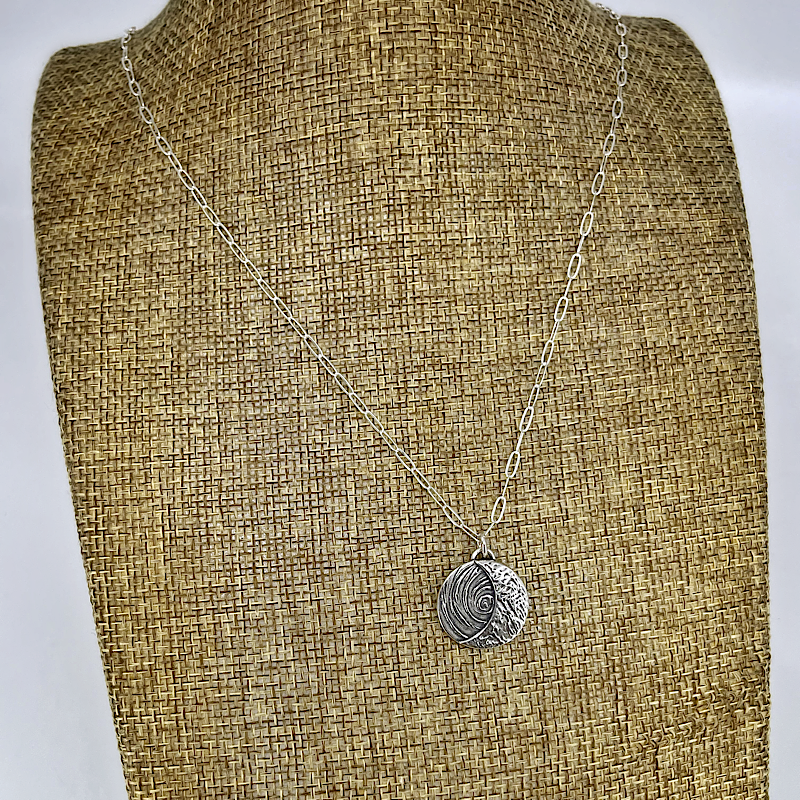 Sterling silver crescent moon pendant shown on linen bust