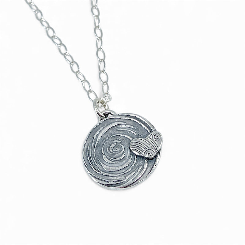 Sterling silver pendant - a heart on a spiral background