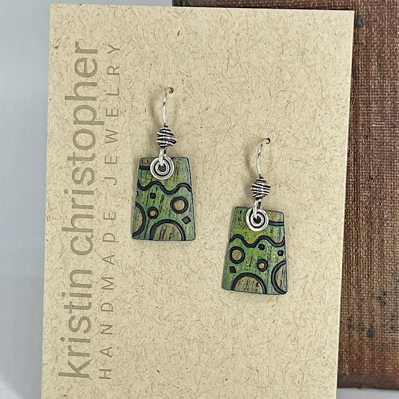 Green patterned earrings on a 'Kristin Christopher Handmade Jewelry' card.