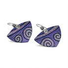 Pair of purple spiral patterned earrings on a white background