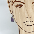 Purple and silver earrings shown on model