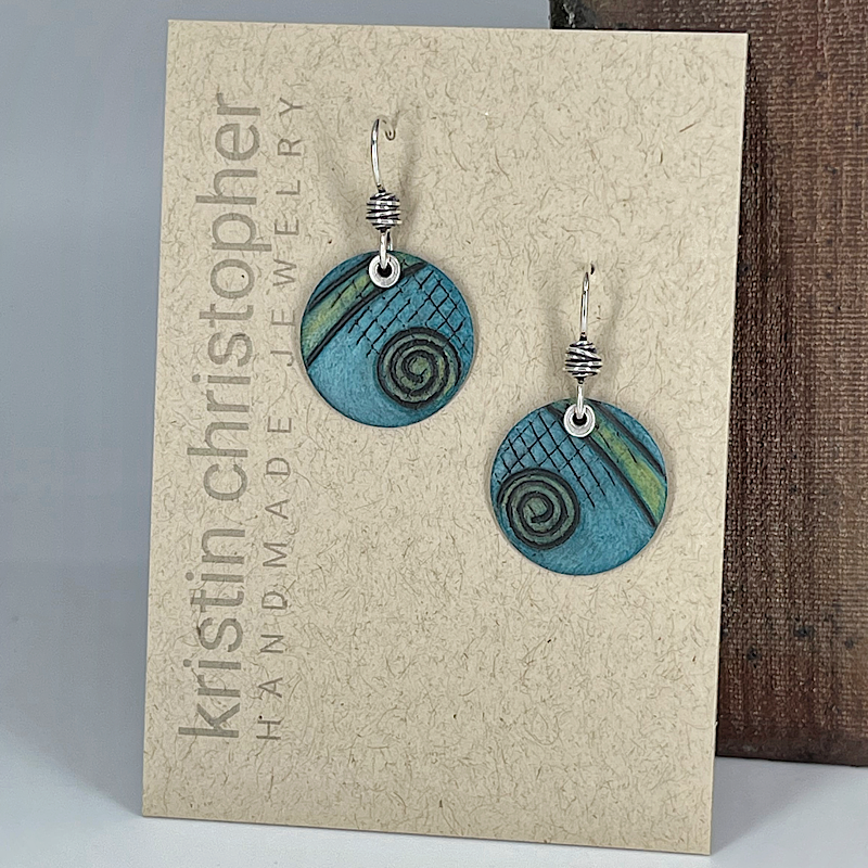 Aqua spiral earrings on a 'Kristin Christopher' card