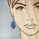 blue spiral pattern earring on a model