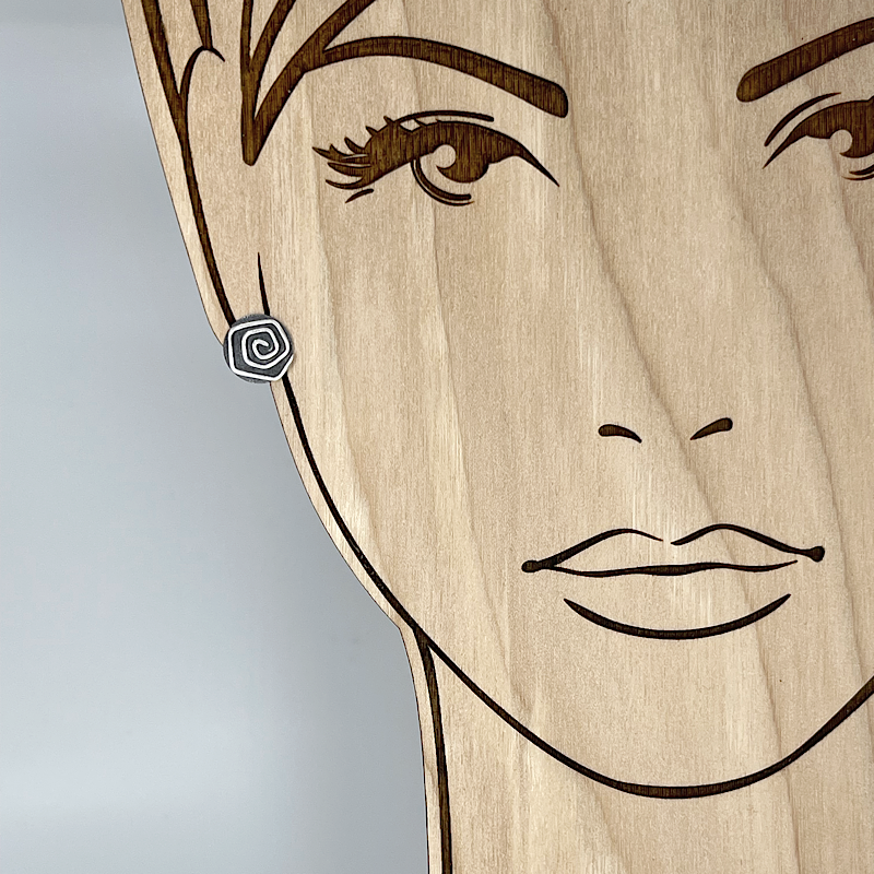 Sterling silver post earrings with spiral shown on model