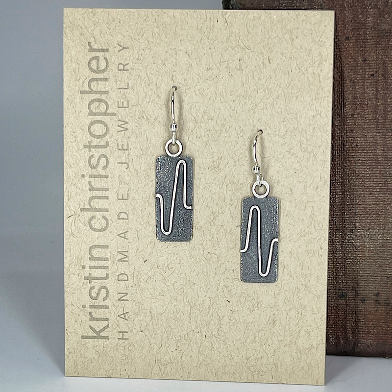 Sterling Silver earrings on a 'Kristin Christopher Handmade Jewelry' card.