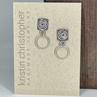 Sterling silver spiral hoop earrings on a 'Kristin Christopher' branded card.