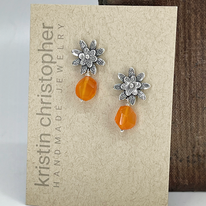 Silver flower post earrings with carnelian gems on a 'Kristin Christopher' card