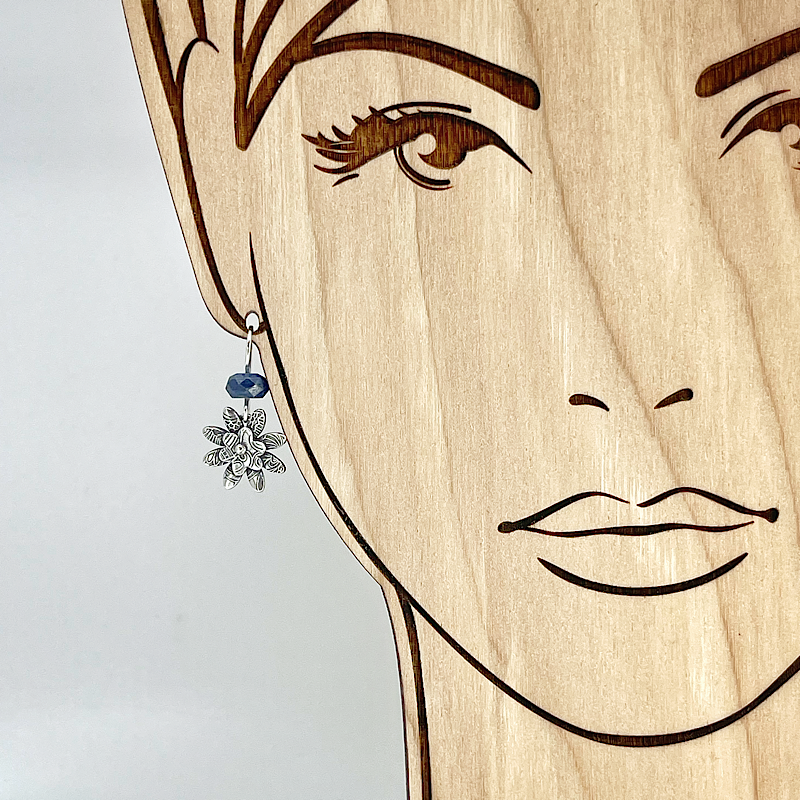 Sterling Silver flower earring with kyanite gemstone shown on model