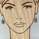 Unique sterling silver earrings shown on a model