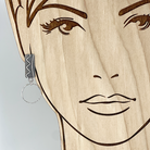 Modern sterling silver post earring with silver hoop, shown on model