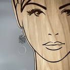 Unique sterling silver earring with hoop shown on model for scale