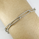 Sterling silver paperclip chain bracelet shown on a mannequin wrist