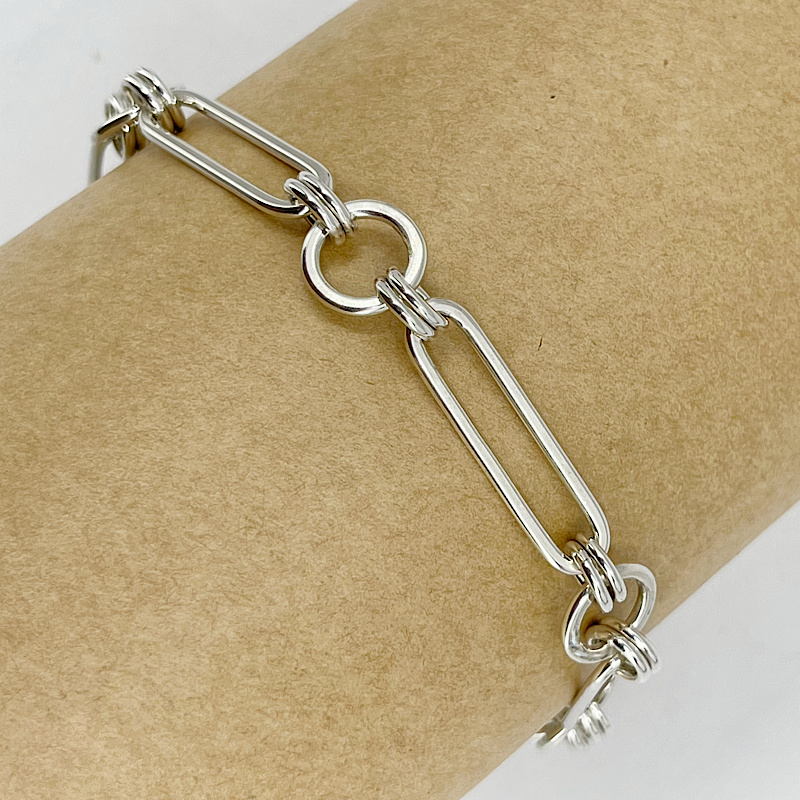 Sterling silver oval & circle bracelet on a mannequin 