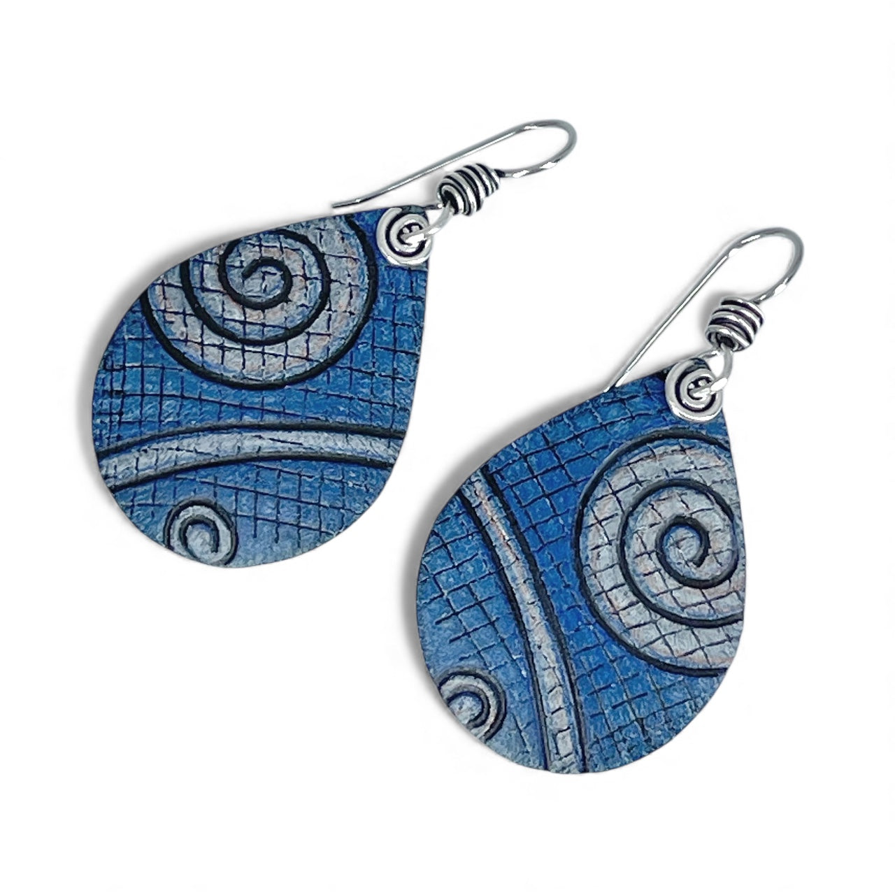 Blue spiral patterned earrings on a white background