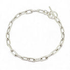 Sterling silver oval link bracelet on white background